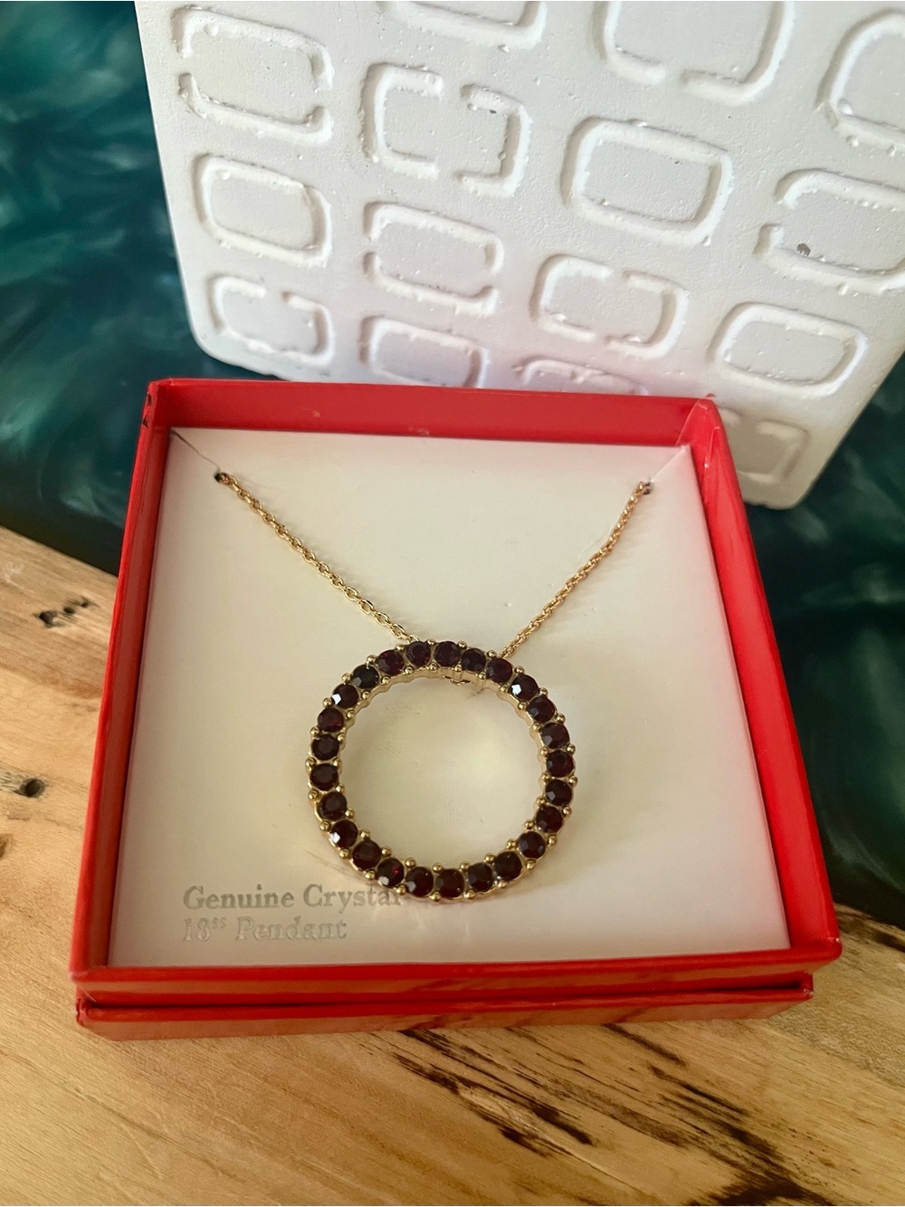 Gold Circle Pendant Necklace with Garnet-Colored Crystals